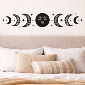 Vinilo decorativo de las fases de la luna en color negro para cabecera de cama.